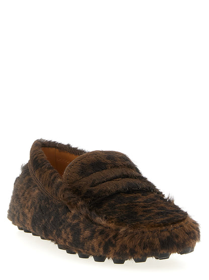 This Flat Loafer Slip-On Shoes by Tod's for women in calfskin leather brown features an exquisite silhouette from the Pony Women's Calfskin Leather Flat Loafer Slip-On Shoes collection, defined by a sophisticated flat and elegant .