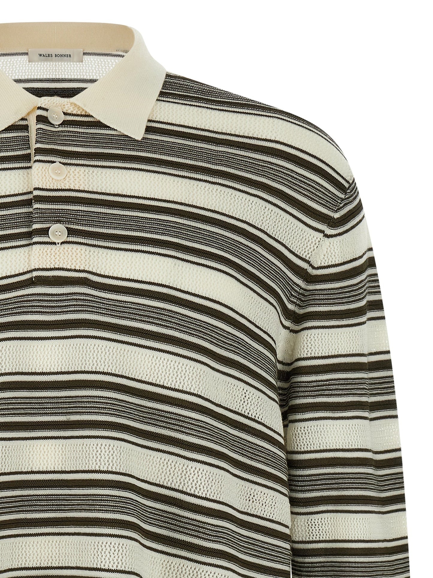 This Polo Shirt by WALES BONNER for men in polyamide viscose wool multicolor, patterned, signature & striped presents a flawless silhouette, showcasing flawless detailing and a refined asymmetric neckline for a truly flawless aesthetic.