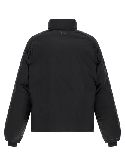 Puffer Jacket by Y-3 for men in nylon black features a dramatic silhouette, showcasing a sophisticated and distinctive windproof, pockets & insulated for a dramatic aesthetic.
