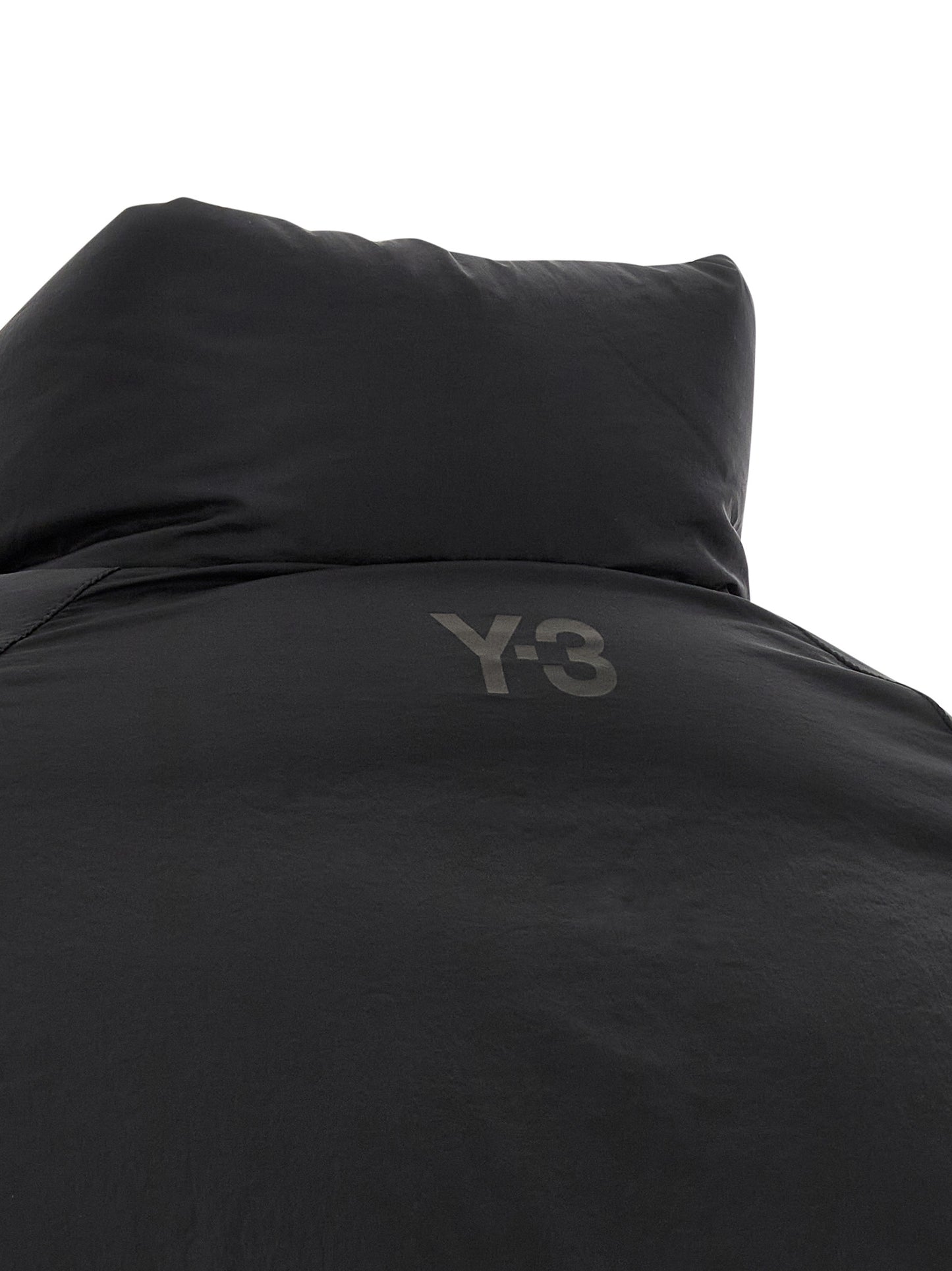 Puffer Jacket by Y-3 for men in nylon black presents a effortlessly chic silhouette, showcasing a sophisticated and premium windproof, pockets & insulated for a truly effortlessly chic finish.
