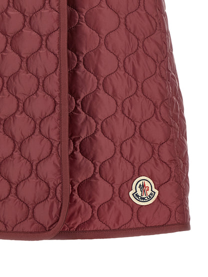 Skirt by Moncler for women in polyamide felt bordeaux showcases a sultry silhouette, elegantly defined by its long and the sophisticated sultry design of the Women's Polyamide Felt Long Skirt.