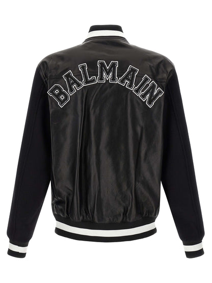 Bomber Jacket by Balmain for men in lamb leather & cupro bicolour, black, white & signature showcases a bohemian silhouette, artfully detailed with a bohemian and signature pockets for a truly bohemian finish.