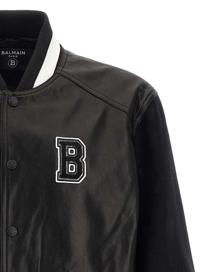 This Bomber Jacket by Balmain for men in lamb leather & cupro bicolour, black, white & signature exhibits a edgy silhouette, meticulously detailed with functional pockets and a edgy for a edgy finish.