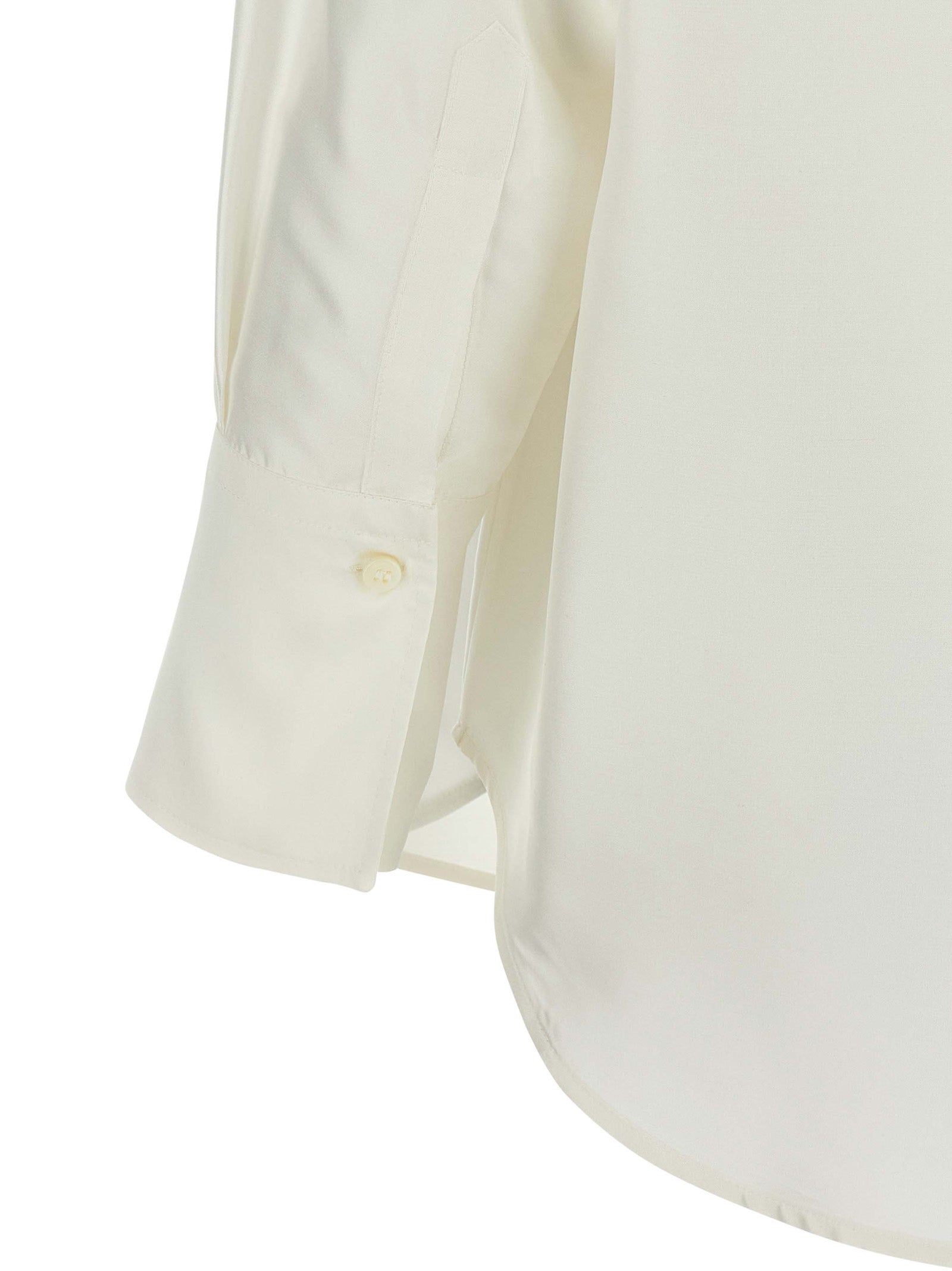 Blouse by Alberto Biani for women in silk white showcases a sharp silhouette, elegantly detailed with a sharp and sharp .