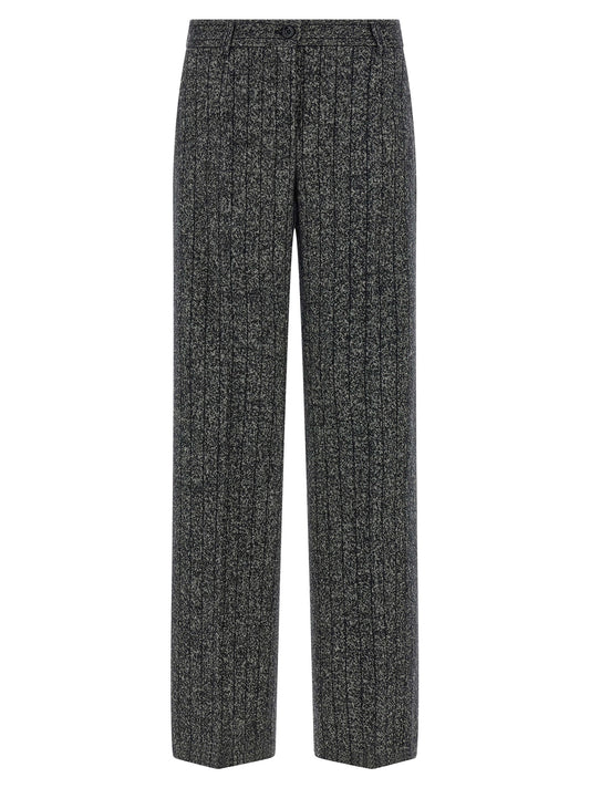 Trousers by Dolce & Gabbana for women in virgin wool & polyamide bicolour, animal, black, white, print & striped features a artisanal silhouette, showcasing a sophisticated straight-leg with a long and low rise for a artisanal finish.