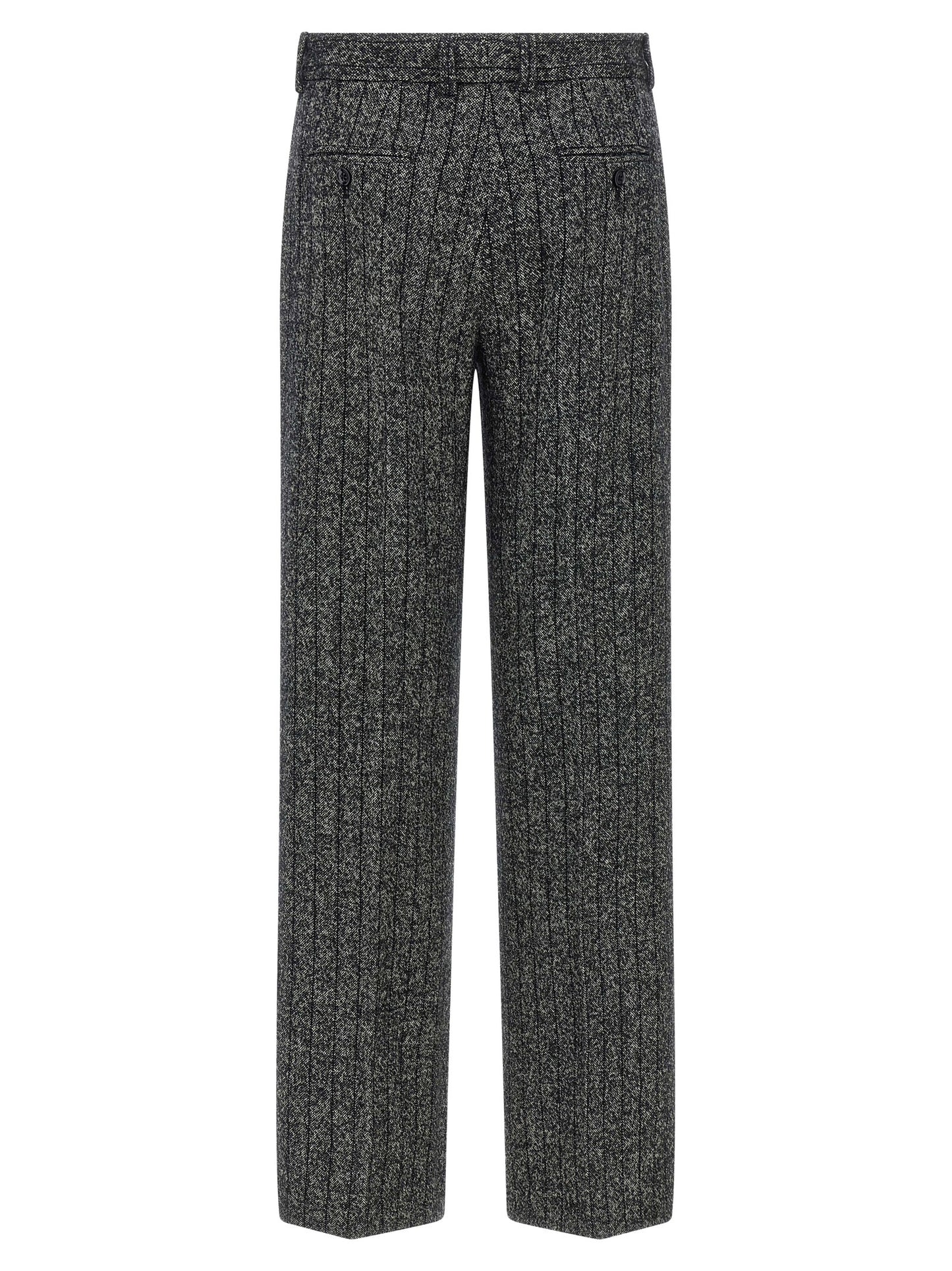 Trousers by Dolce & Gabbana for women in virgin wool & polyamide bicolour, animal, black, white, print & striped features an sartorial silhouette, showcasing a precise straight-leg and long with a sartorial low rise for a refined look.