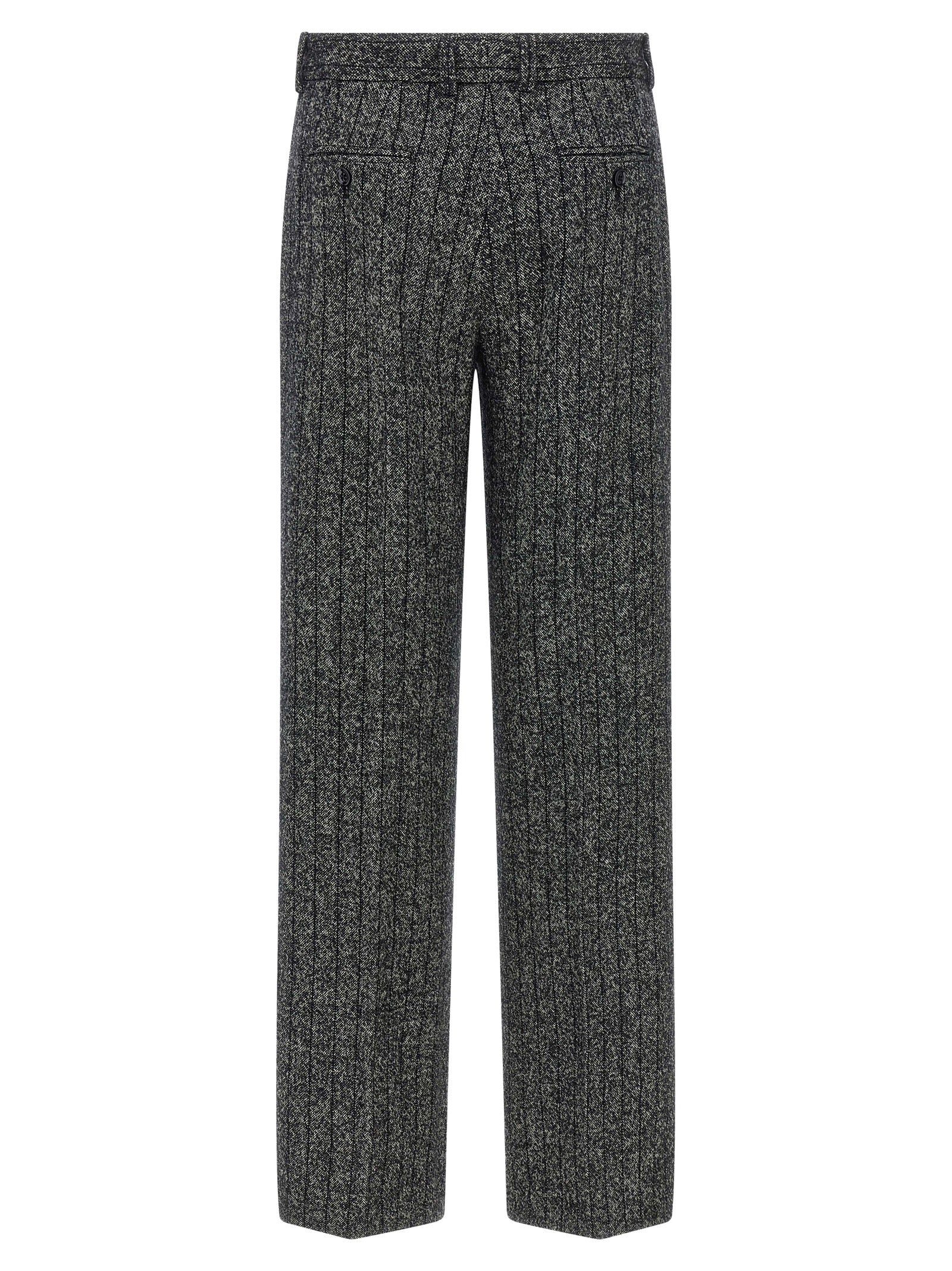 Trousers by Dolce & Gabbana for women in virgin wool & polyamide bicolour, animal, black, white, print & striped features an sartorial silhouette, showcasing a precise straight-leg and long with a sartorial low rise for a refined look.