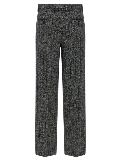 Trousers by Dolce & Gabbana for women in virgin wool & polyamide bicolour, animal, black, white, print & striped features an sartorial silhouette, showcasing a precise straight-leg and long with a sartorial low rise for a refined look.