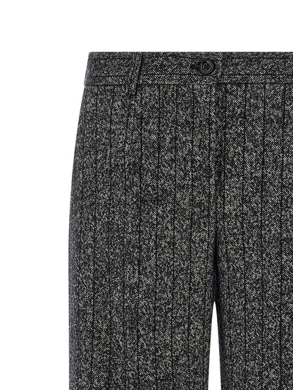 Trousers by Dolce & Gabbana for women in virgin wool & polyamide bicolour, animal, black, white, print & striped presents a smart silhouette, meticulously detailed with a smart straight-leg, a smart long, and a smart low rise.