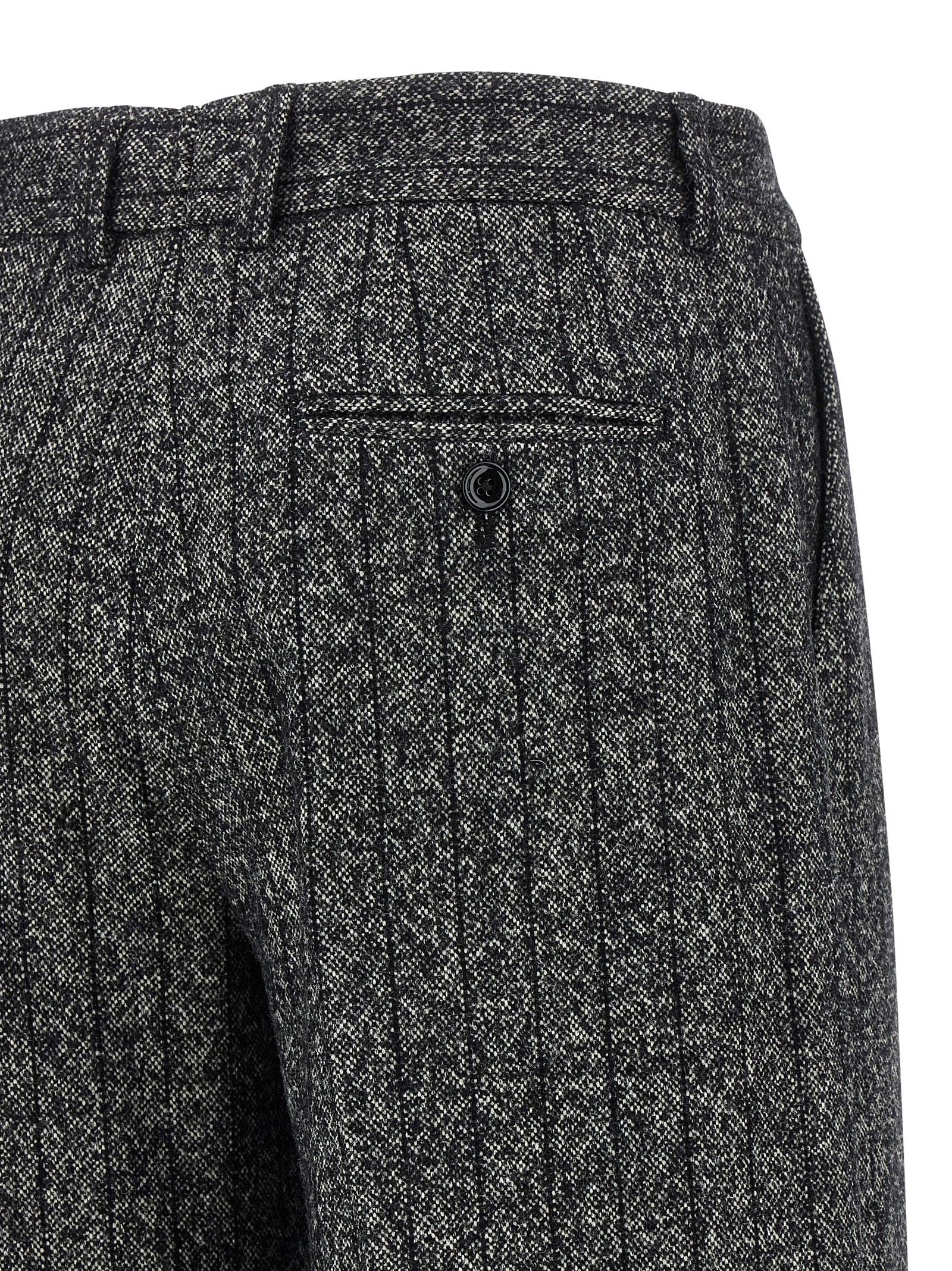 Trousers by Dolce & Gabbana for women in virgin wool & polyamide bicolour, animal, black, white, print & striped features a sculptural silhouette, showcasing a sculptural straight-leg and long with a sophisticated low rise for a sculptural finish.