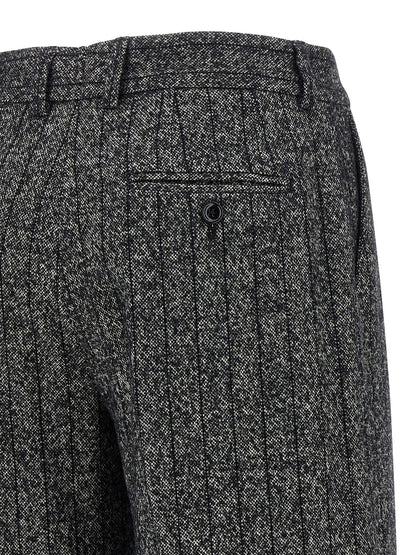 Trousers by Dolce & Gabbana for women in virgin wool & polyamide bicolour, animal, black, white, print & striped features a sculptural silhouette, showcasing a sculptural straight-leg and long with a sophisticated low rise for a sculptural finish.
