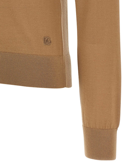 Cardigan by Dolce & Gabbana for women in cashmere beige features a dramatic silhouette, showcasing a sophisticated and dramatic detail for a timeless, premium look.