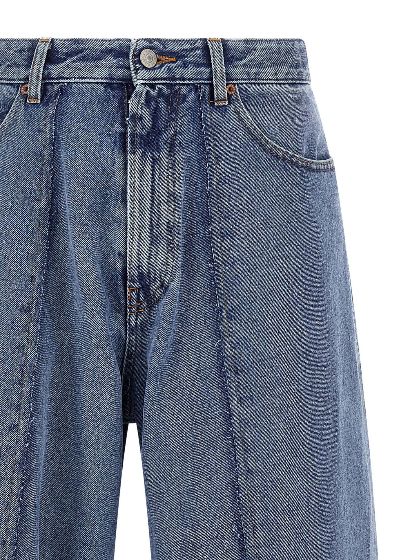 Jeans by MM6 Maison Margiela for men in cotton denim blue presents a tailored silhouette, showcasing a tailored wide and long cut with a refined for a truly tailored aesthetic.