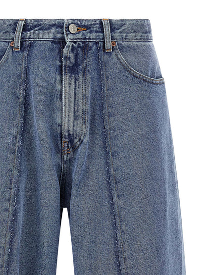 Jeans by MM6 Maison Margiela for men in cotton denim blue presents a tailored silhouette, showcasing a tailored wide and long cut with a refined for a truly tailored aesthetic.