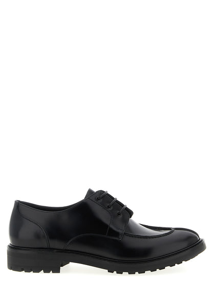 Derby Lace-Up Shoes by Saint Laurent for men in calfskin leather black features an dynamic silhouette from the Men's Calfskin Leather Derby Lace-Up Shoes collection, defined by a dynamic almond toe style and for a dynamic look.