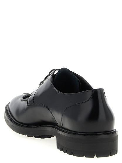 Derby Lace-Up Shoes by Saint Laurent for men in calfskin leather black features an effortless chic silhouette, showcasing the Men's Calfskin Leather Derby Lace-Up Shoes design with an effortless chic and a almond toe style for a effortless chic look.