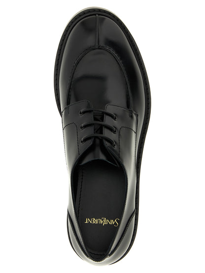 This Derby Lace-Up Shoes by Saint Laurent for men in calfskin leather black features an exquisite silhouette from the Men's Calfskin Leather Derby Lace-Up Shoes collection, defined by a sophisticated and elegant almond toe style.