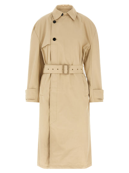 Trench Coat by Entire Studios for women in cotton canvas beige features an dramatic silhouette, perfectly showcasing the elegant split neckline and sophisticated for a truly dramatic aesthetic.
