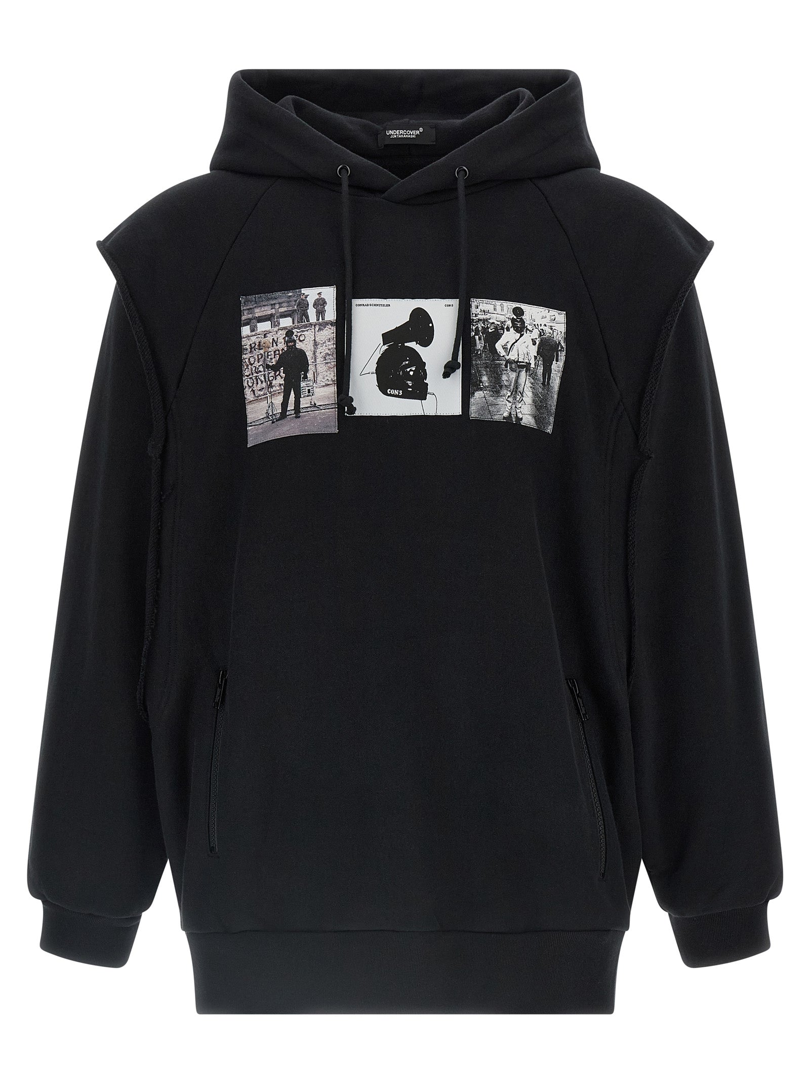 Sweatshirt Hoodie by Undercover for men in cotton black & print features a edgy silhouette, detailed with a edgy hooded neckline and long-sleeve; sleeveless for a refined finish.