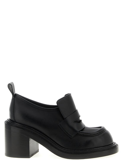 Platform Geometric Loafer Work Shoes by Moschino for women in calfskin leather black showcases a resplendent College Olivia Play Women's Calfskin Leather Platform Geometric Loafer Work Shoes aesthetic, defined by its resplendent and elegant platform geometric-heel.