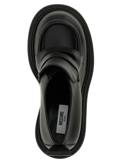 Platform Geometric Loafer Work Shoes by Moschino for women in calfskin leather black features an dynamic silhouette from the College Olivia Play Women's Calfskin Leather Platform Geometric Loafer Work Shoes collection, defined by a dynamic and platform geometric-heel for a dynamic look.
