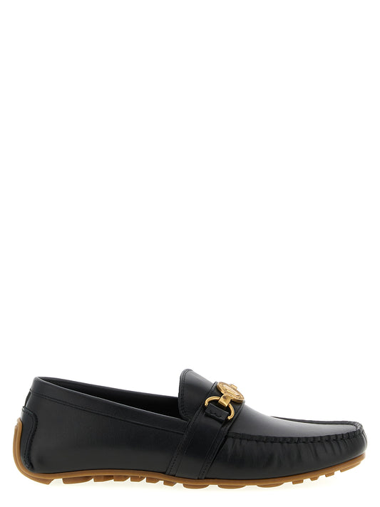 Loafer Slip-On Shoes by Moschino for men in leather & rubber black showcases a resplendent Men's Leather & Rubber Loafer Slip-On Shoes aesthetic, defined by its resplendent and elegant .