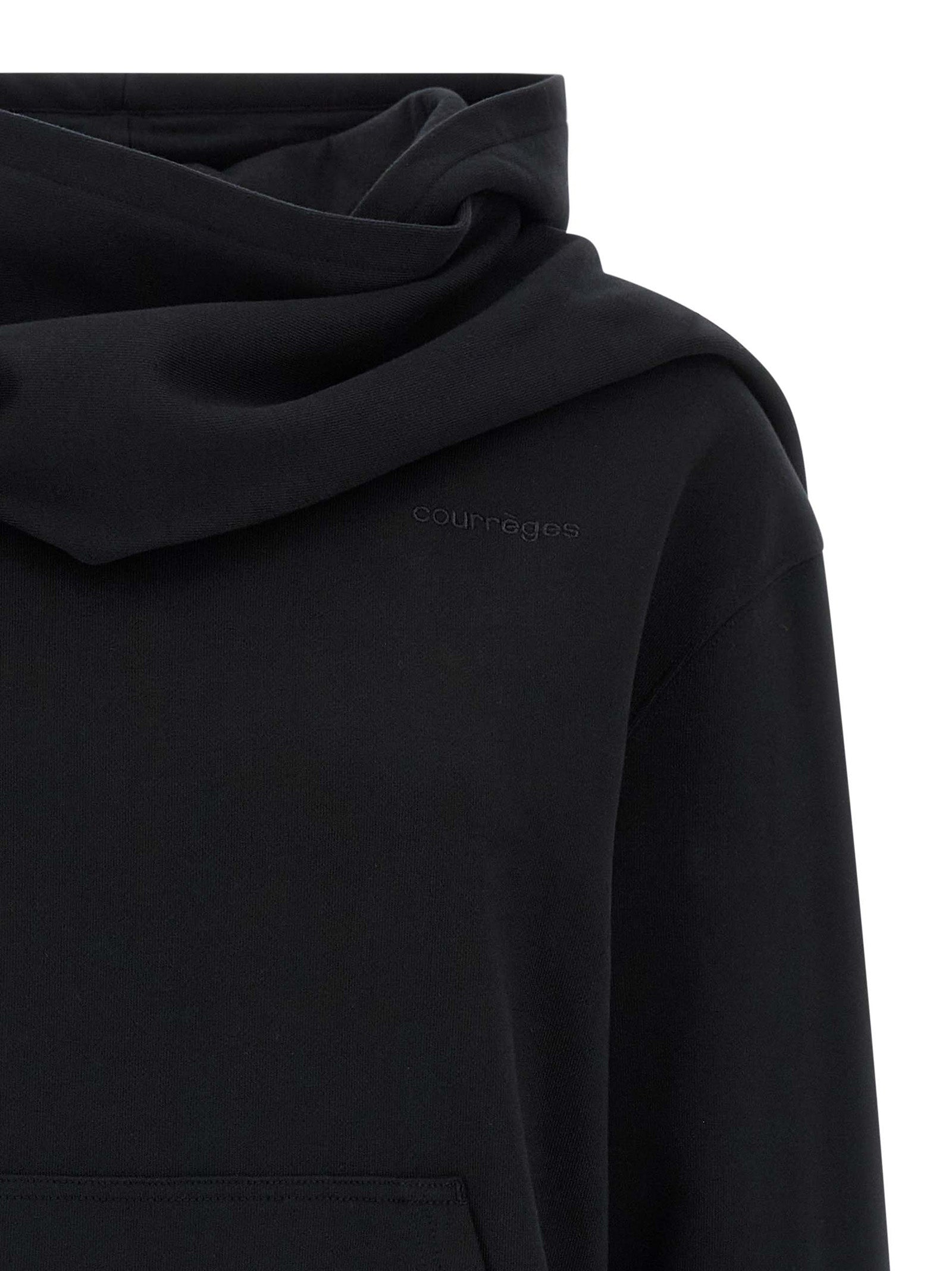 Sweatshirt Hoodie by Courrèges for women in cotton black features a authentic silhouette, showcasing a sophisticated hooded neckline and authentic detail for a refined finish.