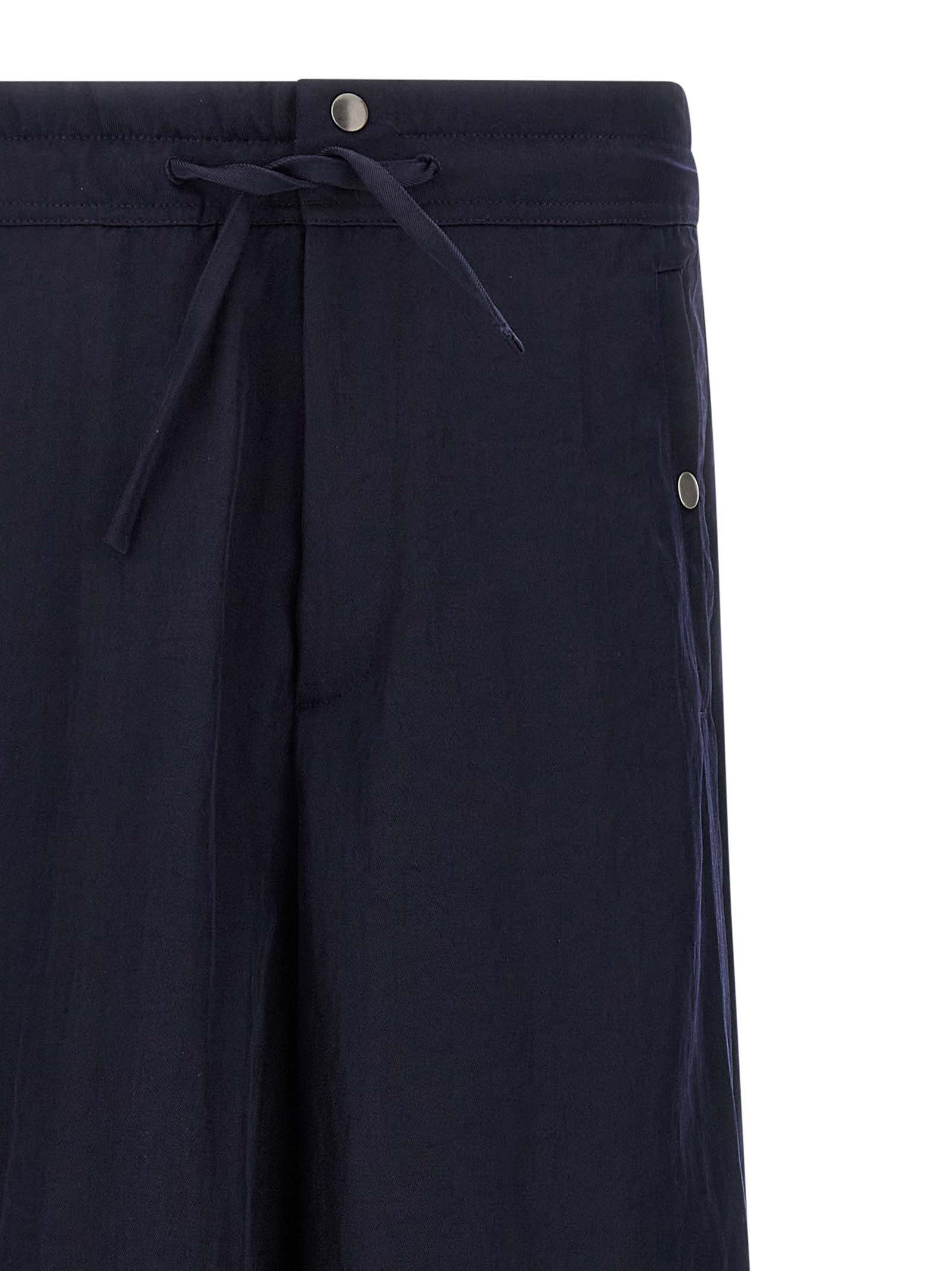 Casual Pants by Dries Van Noten for men in nylon blue features a polished silhouette with a polished straight-leg & wide, reaching a polished long and finished with a polished .