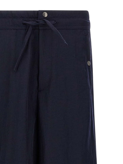 Casual Pants by Dries Van Noten for men in nylon blue features a polished silhouette with a polished straight-leg & wide, reaching a polished long and finished with a polished .