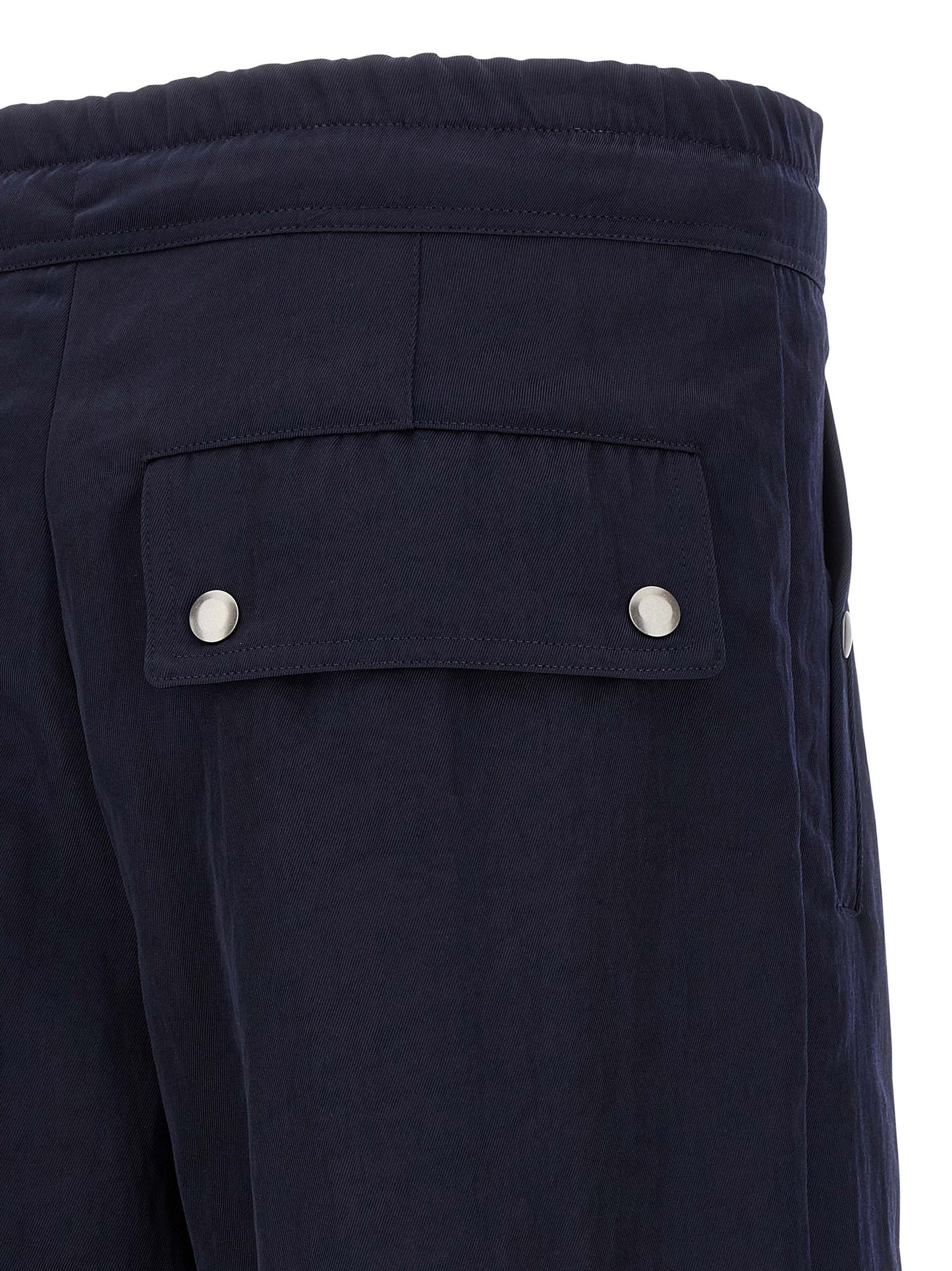 Casual Pants by Dries Van Noten for men in nylon blue presents a tailored silhouette, showcasing a tailored straight-leg & wide and long cut with a refined for a truly tailored aesthetic.