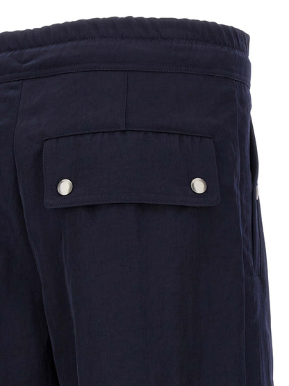 Casual Pants by Dries Van Noten for men in nylon blue presents a tailored silhouette, showcasing a tailored straight-leg & wide and long cut with a refined for a truly tailored aesthetic.
