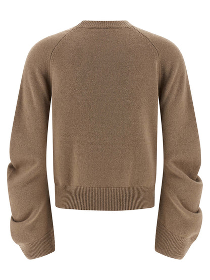 Cardigan by NUDE for women in virgin wool beige & nude showcases a captivating silhouette, artfully detailed with a captivating and for a truly sophisticated captivating look.