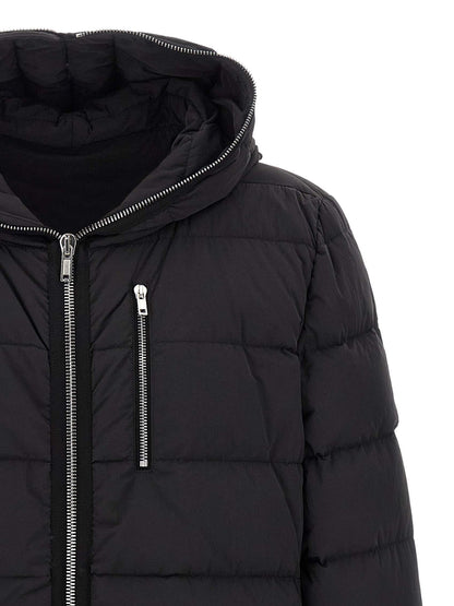 Hooded Puffer Jacket by Rick Owens for men in nylon & goose-down black presents a effortlessly chic silhouette, showcasing a sophisticated hooded neckline and premium lightweight, pockets, hooded & insulated for a truly effortlessly chic finish.