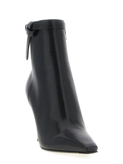 Stiletto Ankle Cut-Out Strap Boots by Jimmy Choo for women in plastic leather & silk black features an high-performance silhouette, showcasing the sophisticated design of the Women's Plastic Leather & Silk Stiletto Ankle Cut-Out Strap Boots with a stiletto and a refined square toe style.