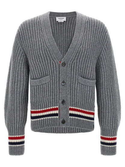 Cardigan by Thom Browne for men in cashmere gray features a dramatic silhouette, showcasing a sophisticated v-neck neckline and dramatic detail for a timeless, premium look.