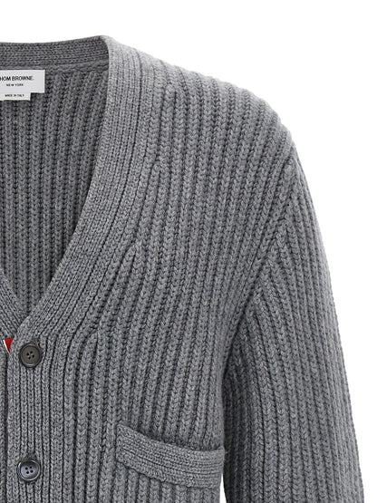 Cardigan by Thom Browne for men in cashmere gray features an crisp silhouette, showcasing a sophisticated v-neck neckline and detail for a truly crisp finish.