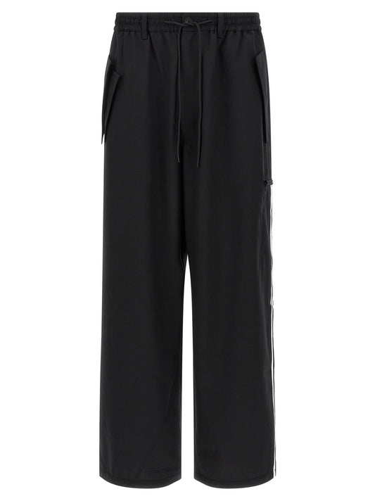 Casual Pants by Y-3 for men in polyester wool black presents a refined pantology silhouette, artfully defined by a refined pantology straight-leg, long, and a sophisticated .