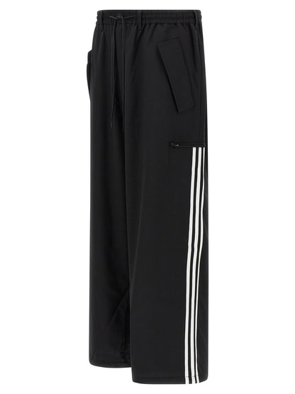 Casual Pants by Y-3 for men in polyester wool black presents a tailored silhouette, showcasing a tailored straight-leg and long cut with a refined for a truly tailored aesthetic.