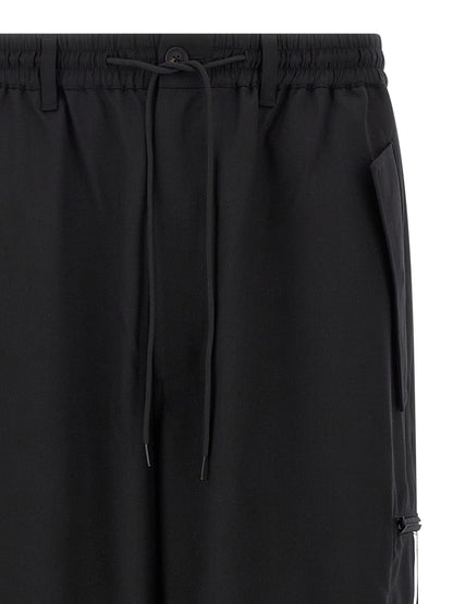 Casual Pants by Y-3 for men in polyester wool black features a polished silhouette with a polished straight-leg, reaching a polished long and finished with a polished .