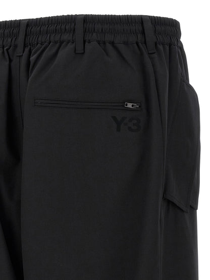 Casual Pants by Y-3 for men in polyester wool black presents a refined pantology silhouette, artfully defined by a refined pantology straight-leg, long, and a sophisticated .