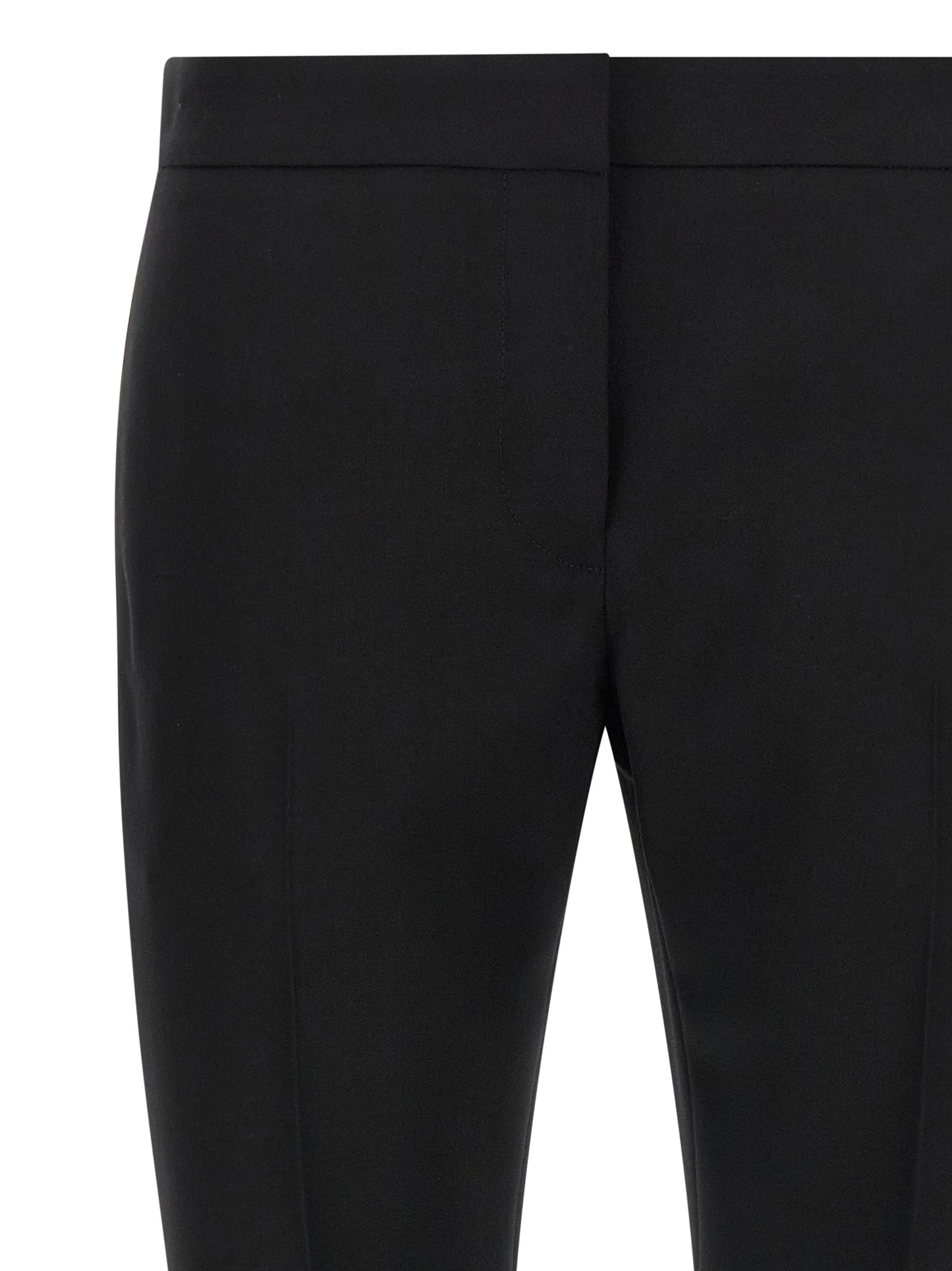 Trousers by Alexander McQueen for women in wool black presents a smart silhouette, meticulously detailed with a smart straight-leg & cigarette, a smart long, and a smart .