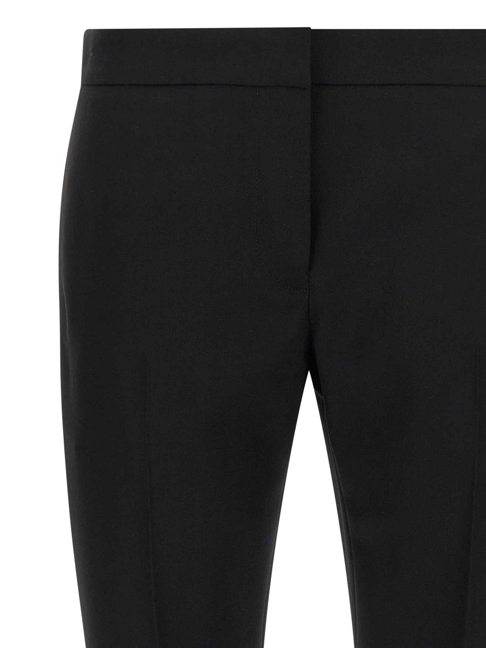 Trousers by Alexander McQueen for women in wool black presents a smart silhouette, meticulously detailed with a smart straight-leg & cigarette, a smart long, and a smart .