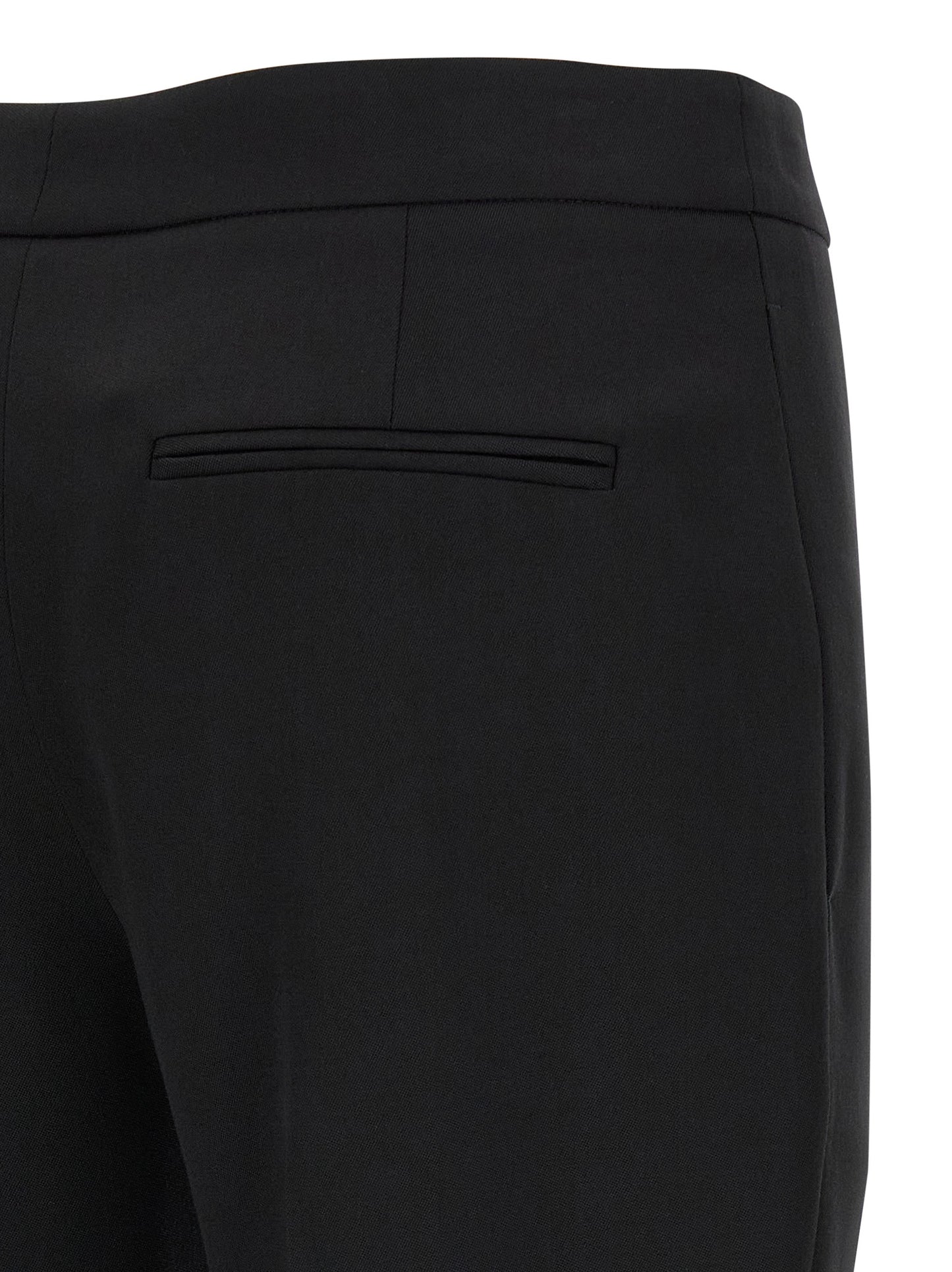 Trousers by Alexander McQueen for women in wool black presents a perennial silhouette, meticulously tailored with a straight-leg & cigarette cut, long finish, and an elegant .