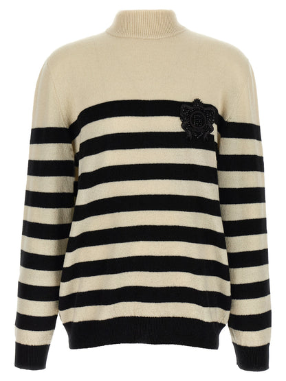 Cardigan by Balmain for men in cashmere bicolour, black, white & striped showcases a luxurious silhouette, meticulously detailed with a sophisticated high-neck neckline and for a refined finish.