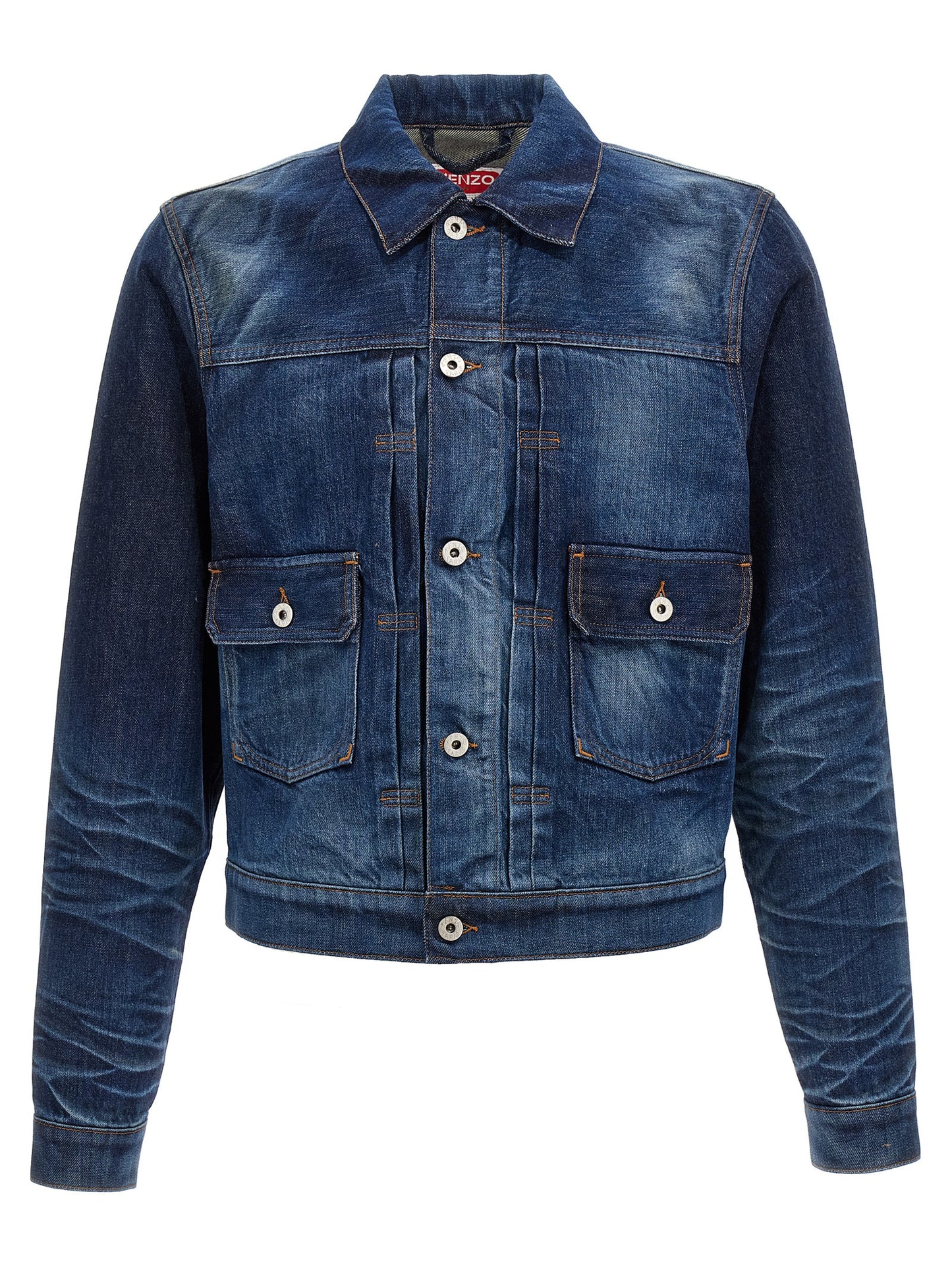 This Trucker Jacket by Kenzo for men in cotton denim blue exhibits a edgy silhouette, meticulously detailed with functional pockets and a edgy shirt-collar neckline for a edgy finish.