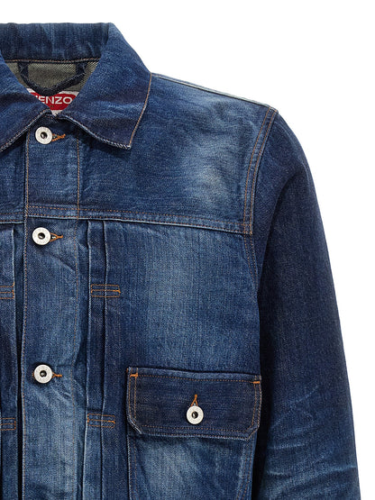 Trucker Jacket by Kenzo for men in cotton denim blue features a dramatic silhouette, showcasing a sophisticated shirt-collar neckline and distinctive pockets for a dramatic aesthetic.