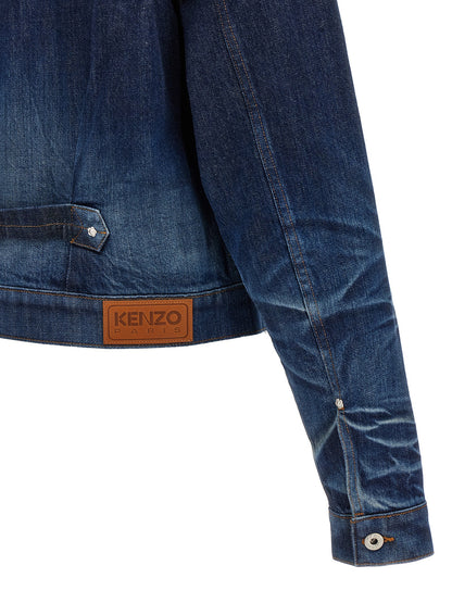 Trucker Jacket by Kenzo for men in cotton denim blue showcases a bohemian silhouette, artfully detailed with a bohemian and signature pockets for a truly bohemian finish.