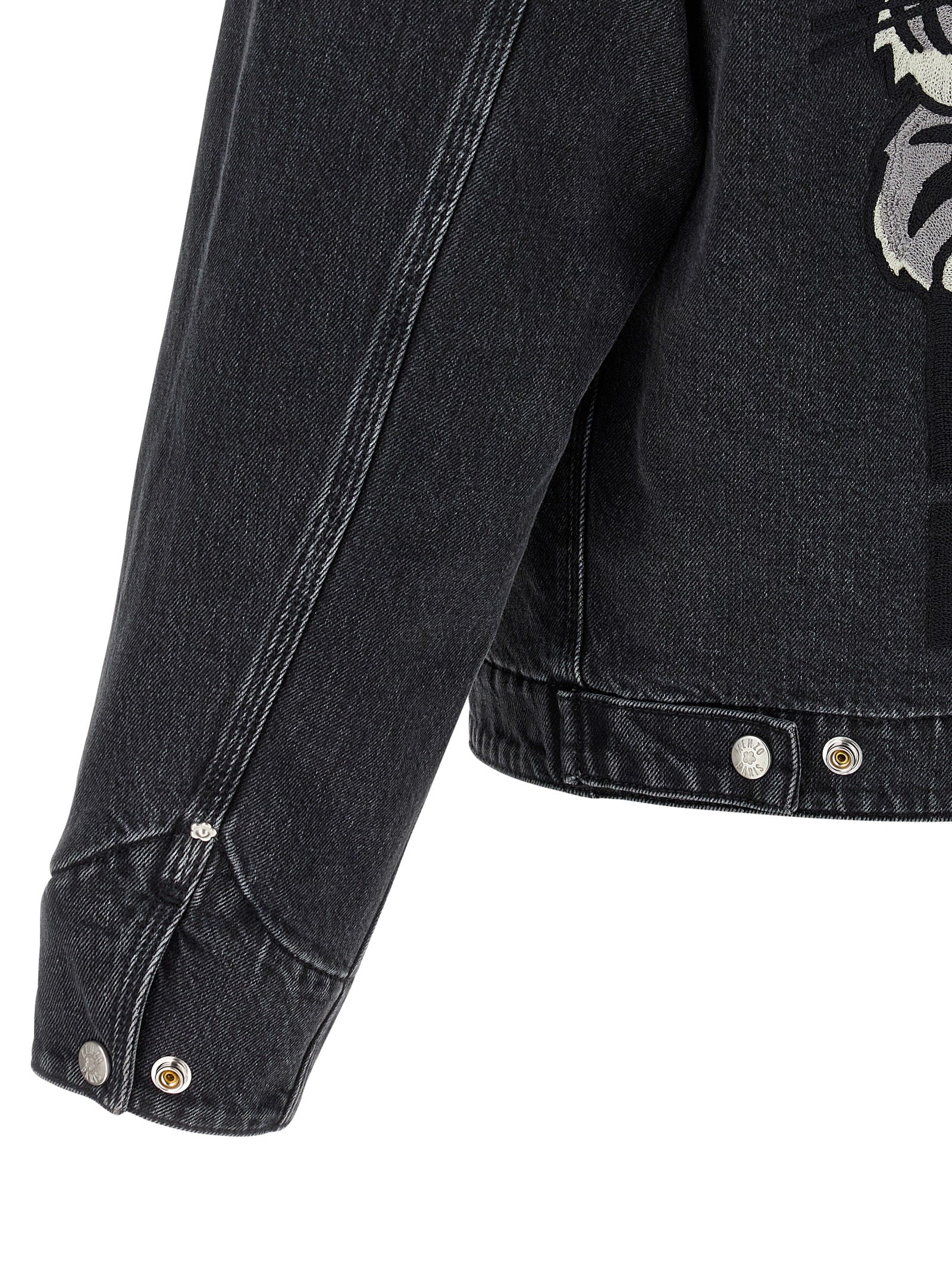 Trucker Jacket by Kenzo for men in stretch denim cotton black presents a effortlessly chic silhouette, showcasing a sophisticated and premium pockets for a truly effortlessly chic finish.