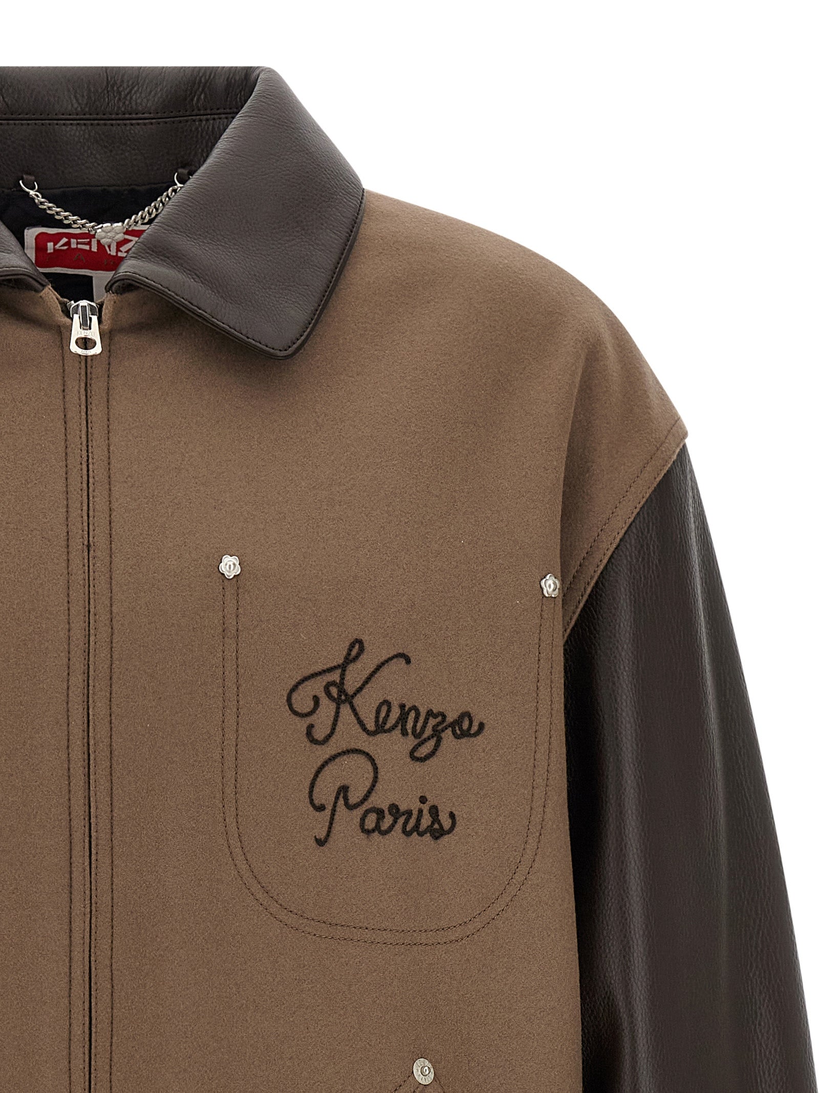 Jacket by Kenzo for men in polyamide grained leather & virgin wool brown presents a authentic silhouette, artfully detailed with a authentic and functional pockets & insulated for a premium authentic finish.