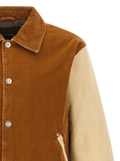Bomber Jacket by WALES BONNER for men in cotton corduroy brown features a city-ready silhouette, detailed with pockets & insulated and a city-ready wrap shirt-collar neckline.
